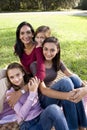 Mother and three children in park Royalty Free Stock Photo