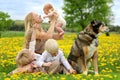 Mother and Three Children Playing in Flower Meadow Royalty Free Stock Photo