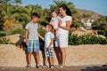 Mother with three kids on Turkey resort against palms