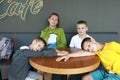Mother with three sons waiting food Royalty Free Stock Photo
