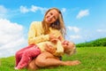 Mother tickling funny baby son lying on her laps Royalty Free Stock Photo