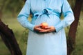Pregnant Woman Holding an Apple as Healthy Snack Royalty Free Stock Photo