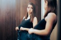 Funny Pregnant Woman Unable to Fit in her Old Pants Royalty Free Stock Photo