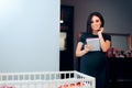 Woman Writing Baby Names List and Maternity Checklist