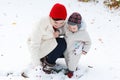 Mother and toddler boy having fun with snow on winter day Royalty Free Stock Photo