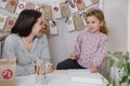 Mother, toddler child writing Christmas letter, advent calendar task Royalty Free Stock Photo