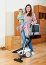Mother and toddler doing house cleaning