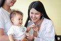 The mother took a small son to see the doctor regularly on an appointment. To check the health