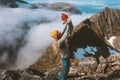 Mother traveling with baby holding up child family parents hiking with kid in mountains Royalty Free Stock Photo