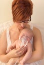 Mother treating baby with aerosol Royalty Free Stock Photo