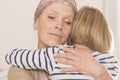 Mother with tumor hugging child Royalty Free Stock Photo