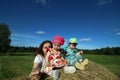 Mother with twins in field