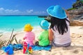 Mother with twins on the tropical beach holidays Royalty Free Stock Photo