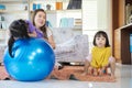 A mother, two Asian daughters, happily playing at home Royalty Free Stock Photo