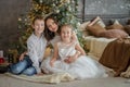 Mother and two childre under Christmas tree Royalty Free Stock Photo