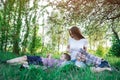 Mother and two children on picnic in Park. Carefree motherhood childhood