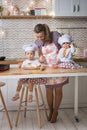 Mother and two daughters cooking in the kitchen Royalty Free Stock Photo