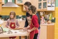 Mother with two daughters cookies Royalty Free Stock Photo