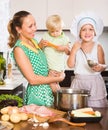 Mother with two daughters cooking Royalty Free Stock Photo