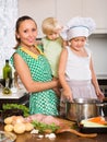 Mother with two daughters cooking Royalty Free Stock Photo