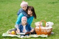 Mother and two daughters on a picnic