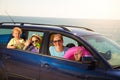 Mother with two kids travel by car on sea vacation Royalty Free Stock Photo