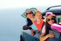 Mother with two kids travel by car on sea vacation Royalty Free Stock Photo