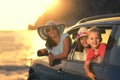 Mother with two kids travel by car on summer vacation sunset Royalty Free Stock Photo