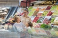 Mother of Two Shopping in Supermarket Royalty Free Stock Photo