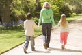 Mother and two young children walking on path Royalty Free Stock Photo