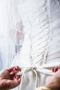 Mother Tying the Bride's Wedding dress