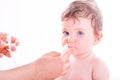 Mother using baby nasal aspirator. Royalty Free Stock Photo