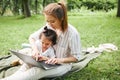 Mother using Laptop in Park Royalty Free Stock Photo