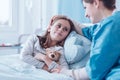 mother visiting sick daughter in hospital