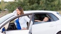 Mother waiting with son in car