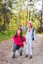 Mother walking with her child in warm sunny autumn day