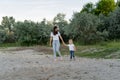 Mother walking with her daughter by the lake Royalty Free Stock Photo