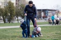 Mother walking with her two children off the leash