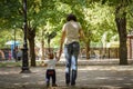 Mother walks with her child holding his hand in the autumn park. Responsible parenthood concept Royalty Free Stock Photo