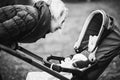 Mother walks with a stroller in the autumn park Royalty Free Stock Photo