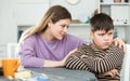 Mother wants to talk with his son after conflict at table