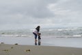 Mother and baby playing on beach