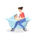 Mother wash boy in the bath. Baby bathing. Idea of health