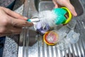 Mother washing baby milk bottle Royalty Free Stock Photo