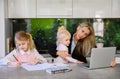 Mother working from home with children around Royalty Free Stock Photo