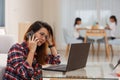 Mother working from home with kids. Quarantine and closed school during coronavirus outbreak. Children make noise and disturb Royalty Free Stock Photo