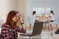 Mother working from home with kids. Quarantine and closed school during coronavirus outbreak. Children make noise and disturb Royalty Free Stock Photo