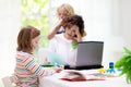Mother working from home with kids. Quarantine Royalty Free Stock Photo