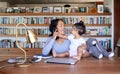 Mother working from home phone call with baby. Hispanic woman making call on smartphone. Teleworking businesswoman at Royalty Free Stock Photo