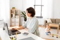 Mother working at laptop and baby boy at home Royalty Free Stock Photo